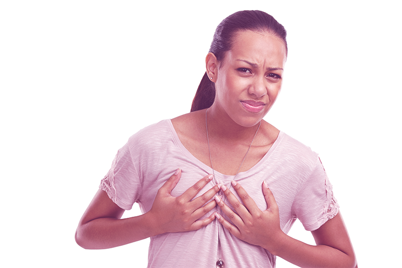 woman holding her breasts and worried about breast issues