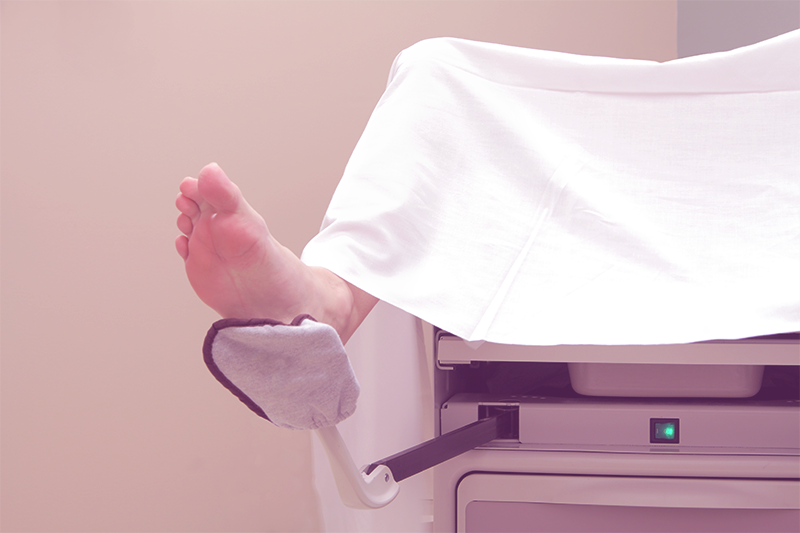 feet in stirrups at a pelvic exam before a pap smear
