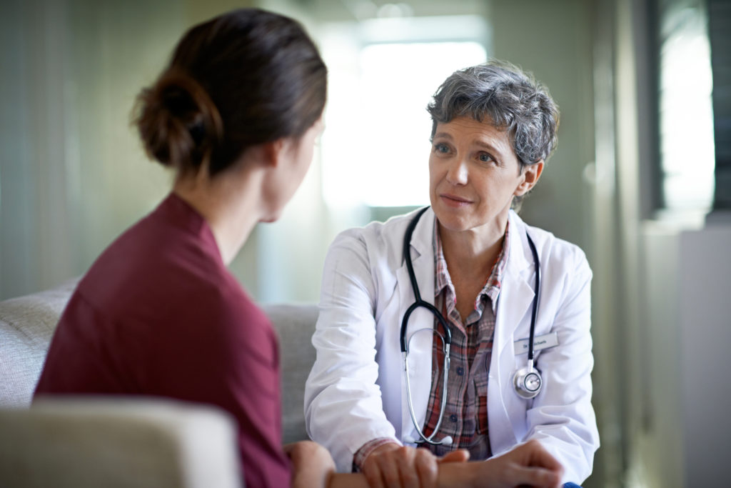 doctor explaining to a patient about surgical menopause