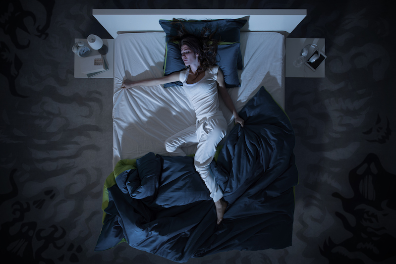 woman in bed with a night sweat