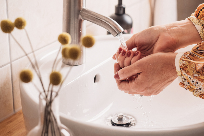 close-up of woman washing her hands to fight against coronavirus
