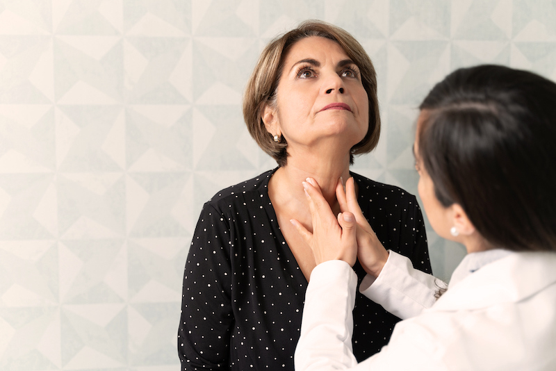 white woman visiting female geriatrician for thyroid checkup