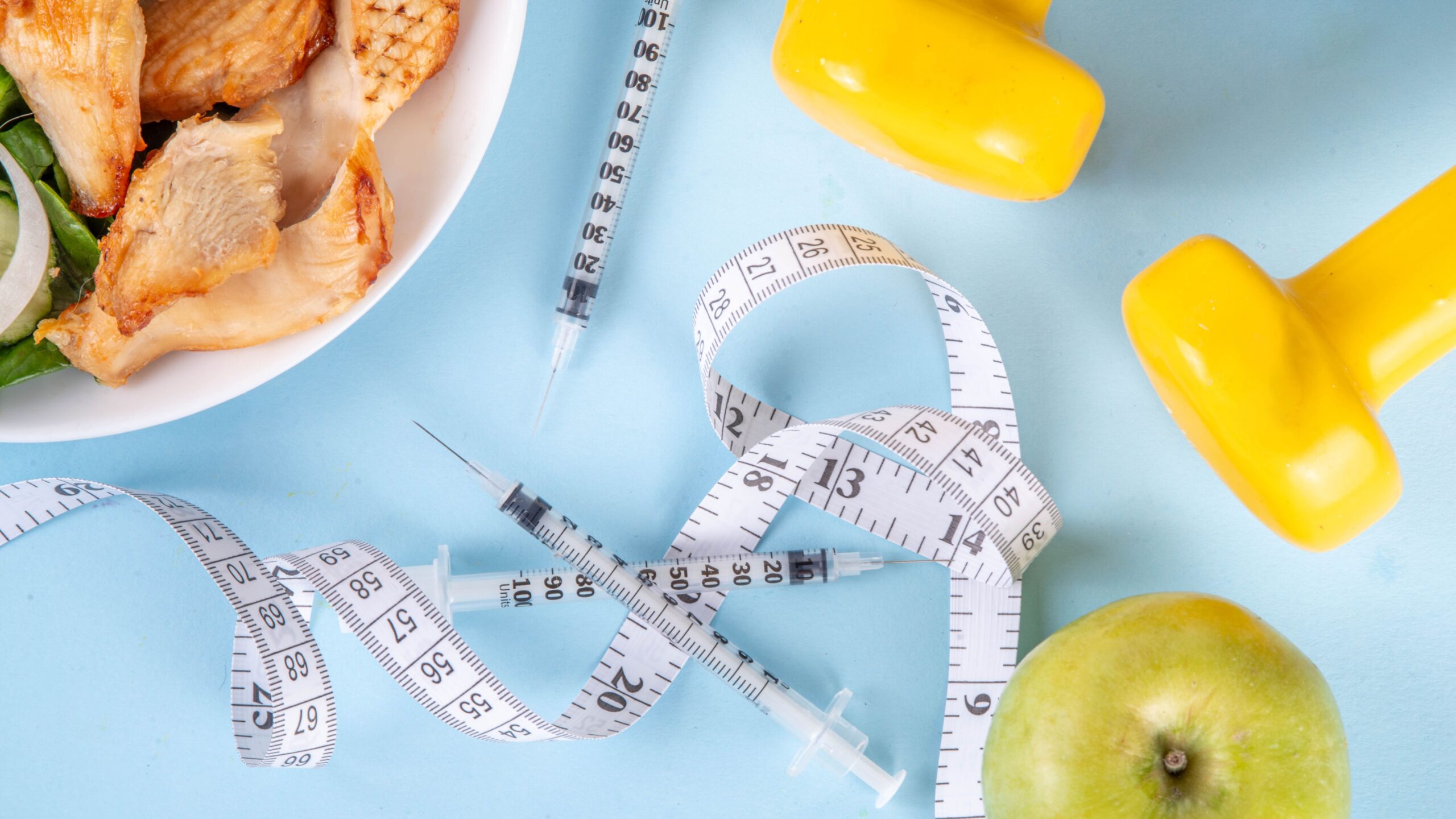 image of tape measure, weights, apple. and chicken