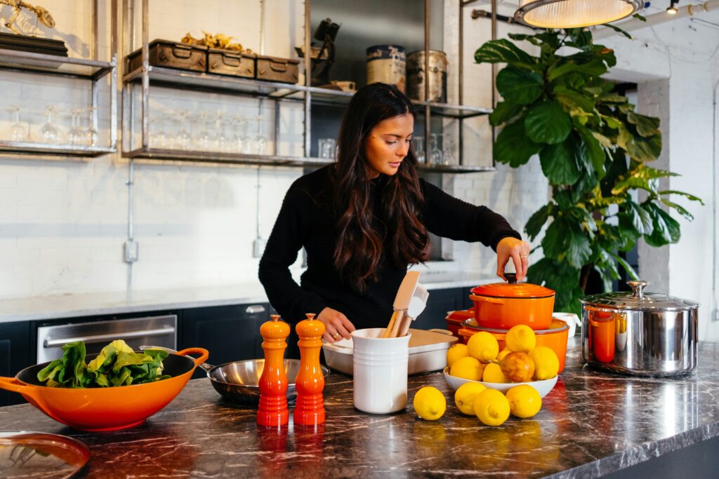 woman cooking with vegetables