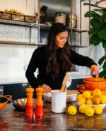 woman cooking with vegetables