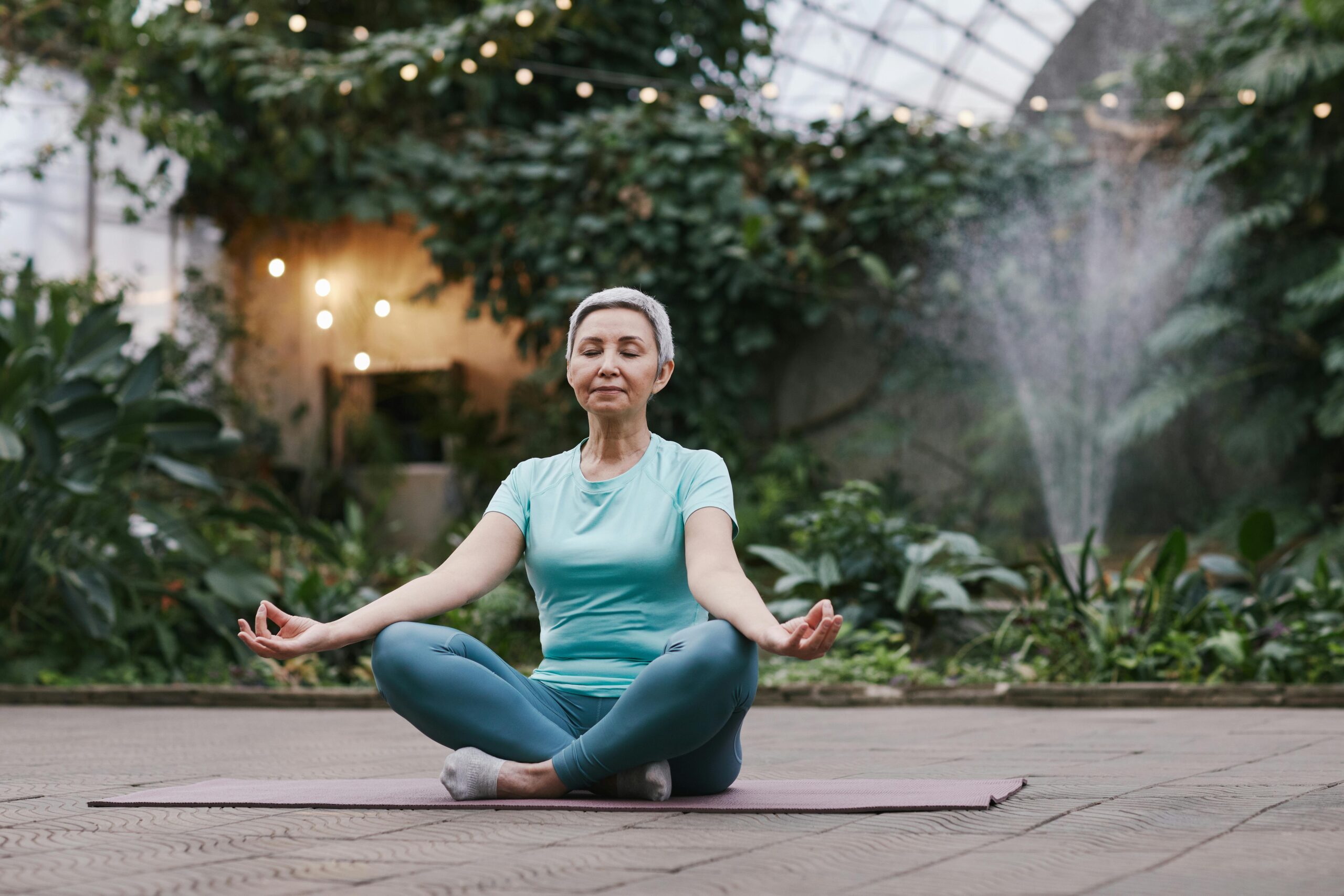 Mature woman on yoga mat