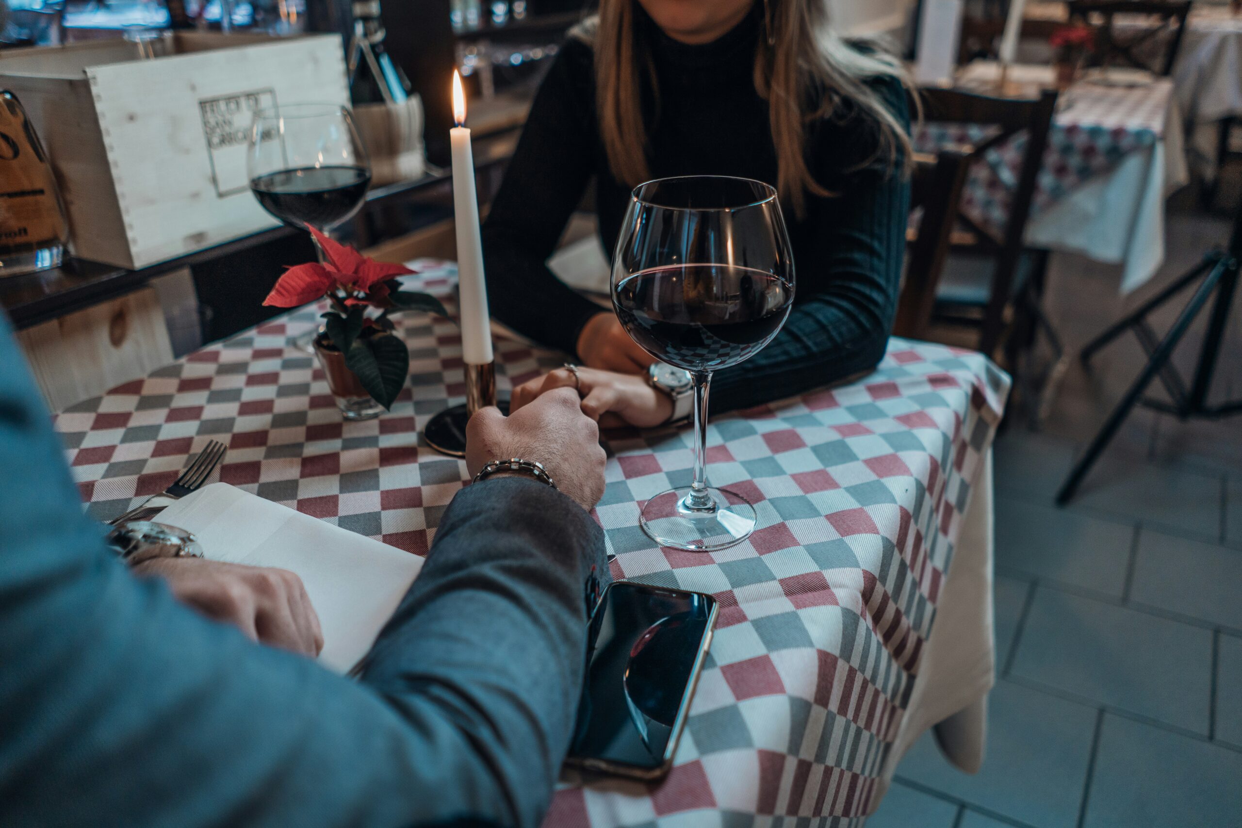 couple holding hands at a date