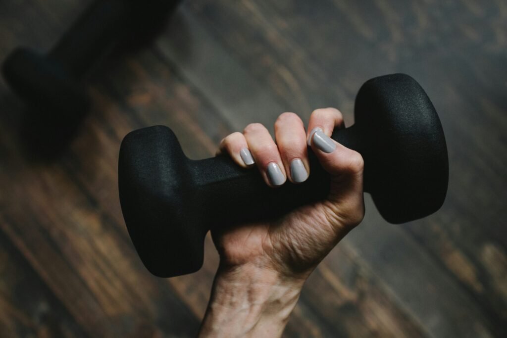 woman holding dumbbell