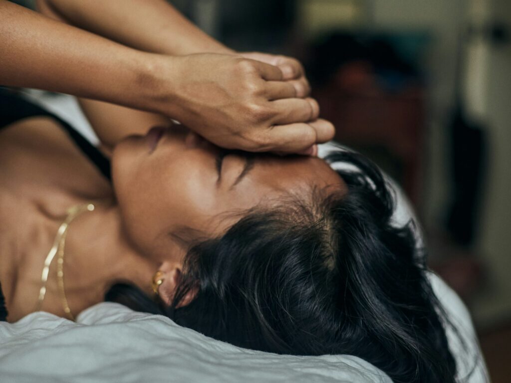 woman holding face