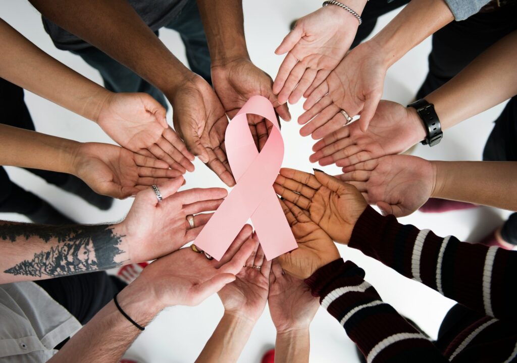 women holding pink ribbon