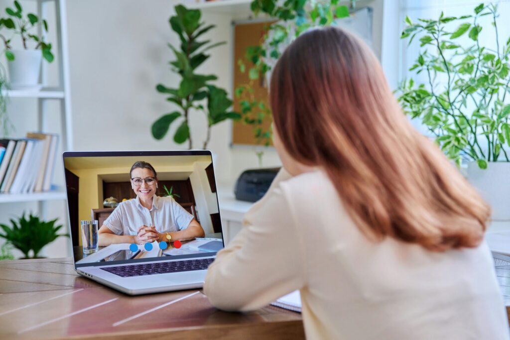 woman talking to someone on computer