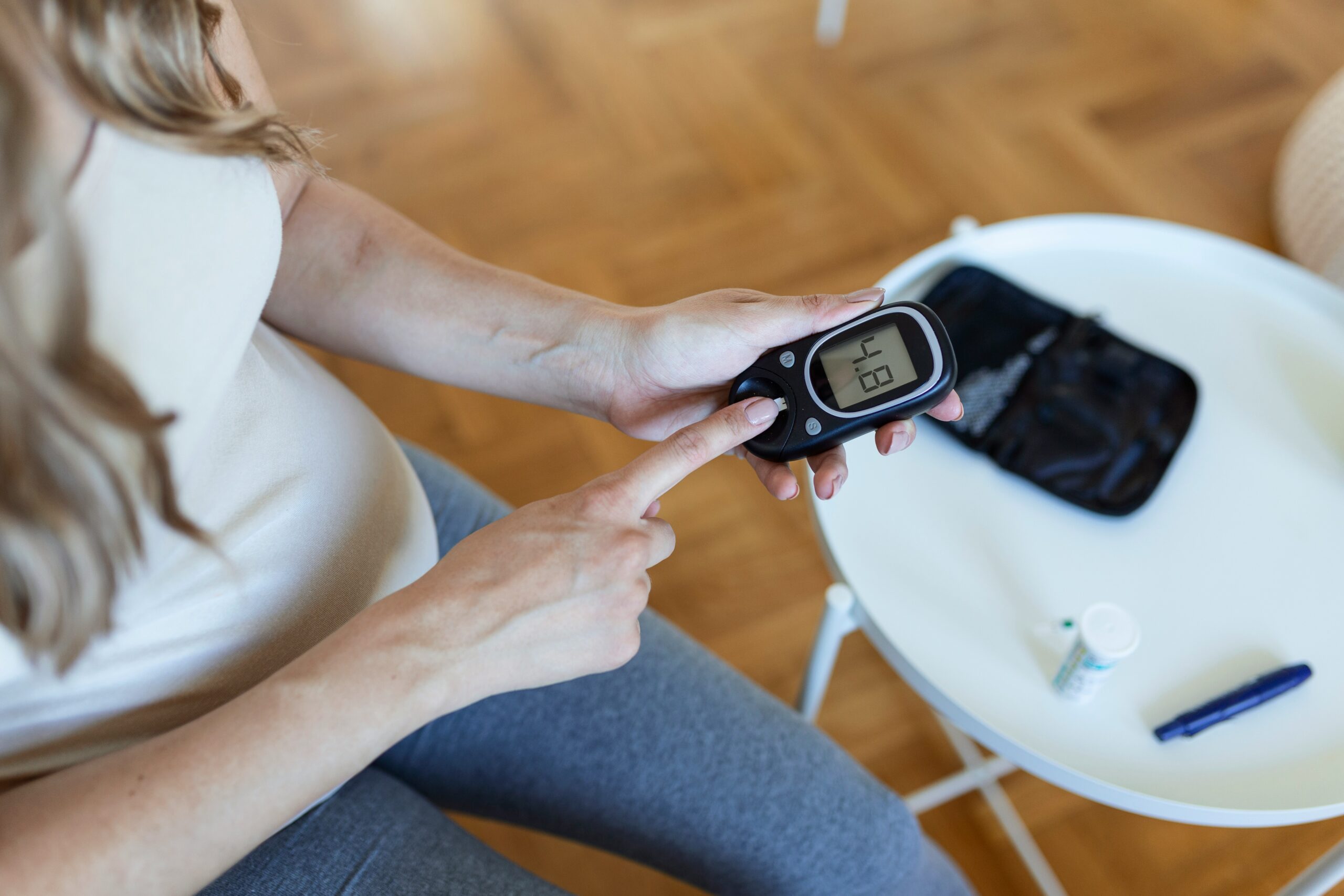 women using glucometer