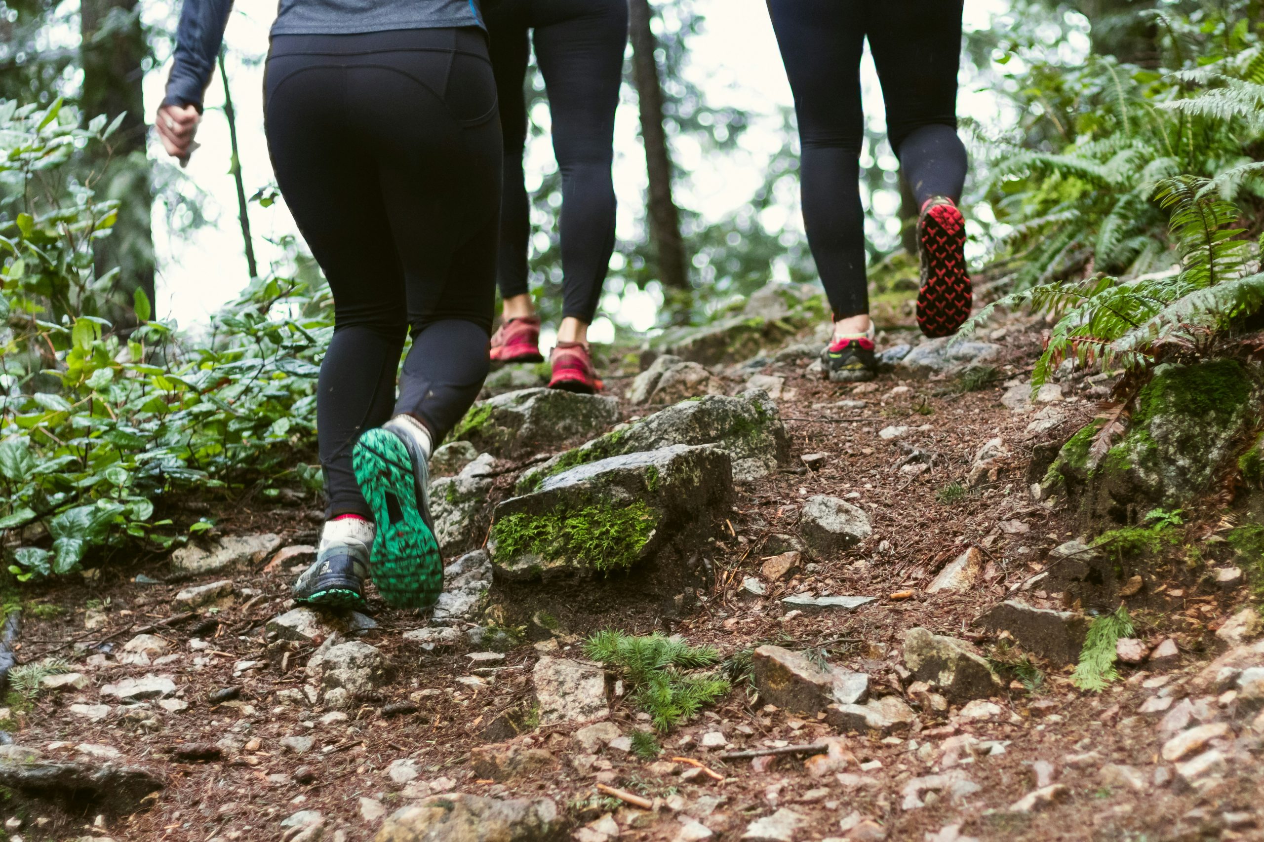 legs of three walking women