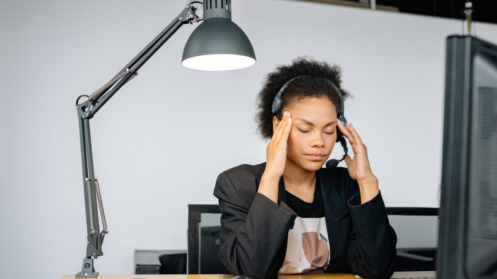 Woman in her 30's showing signs of burnout, looking for solutions.